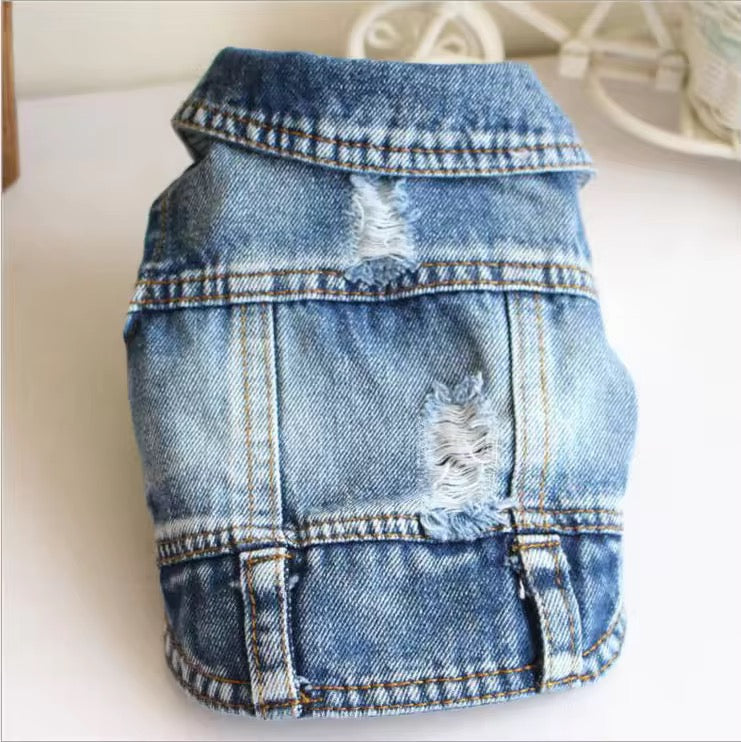 Denim cat vest with distressed details on a white background